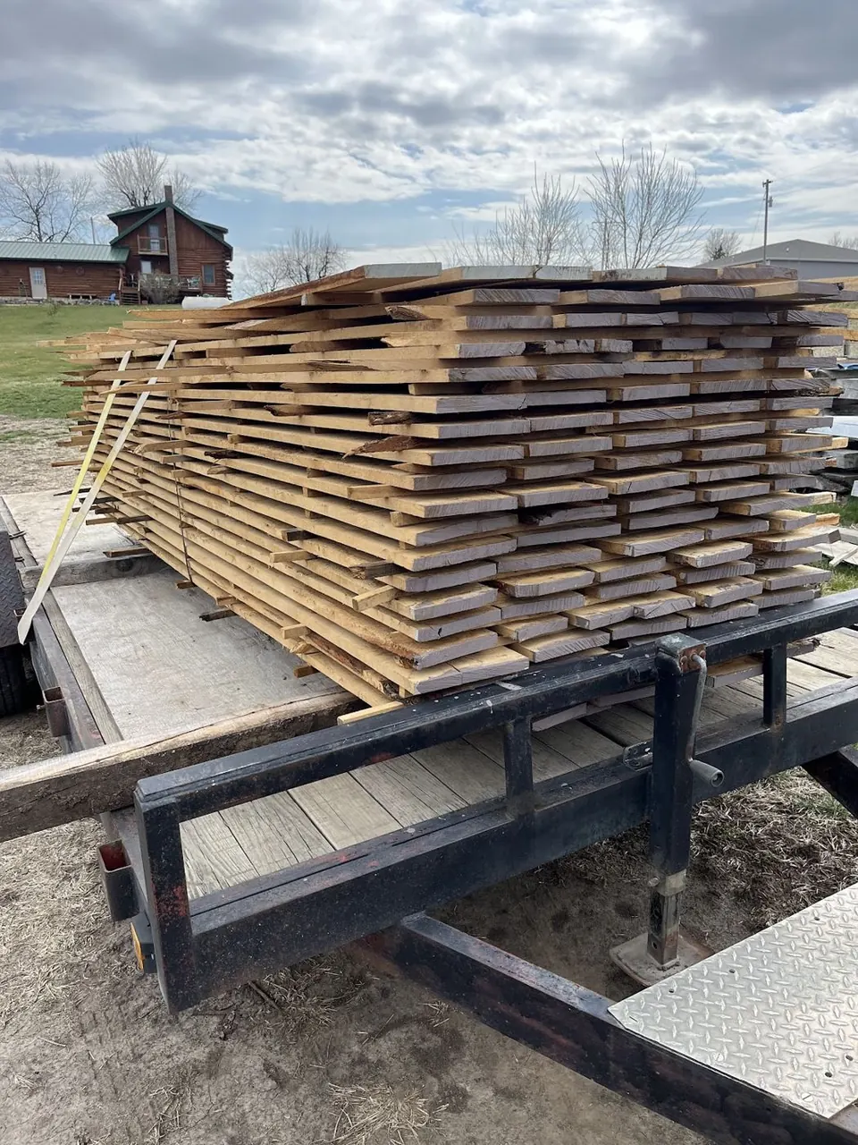 Salvaged lumber stacked on a trailer at the mill